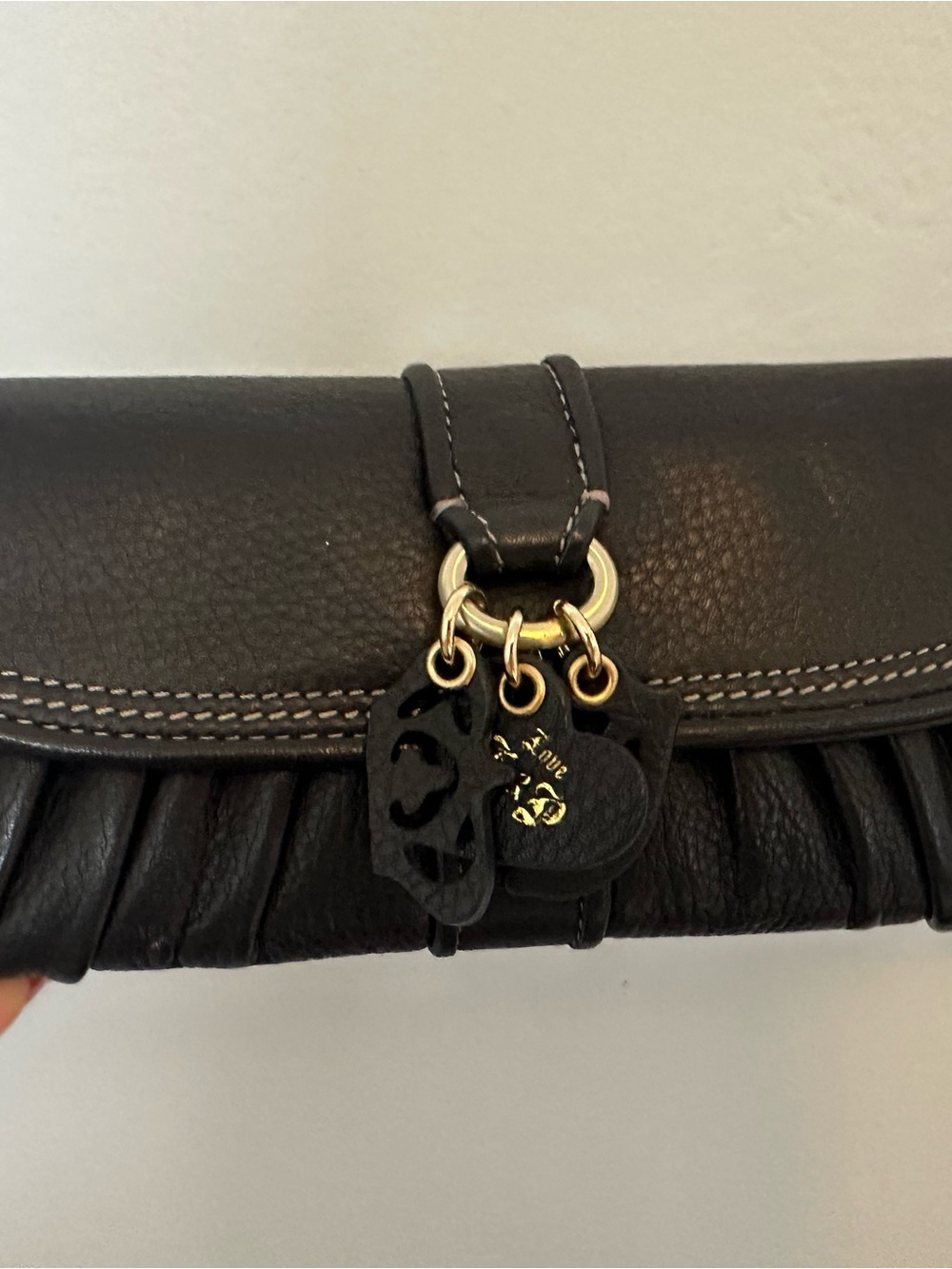 Juicy Couture Black Leather Clutch with Gold Charm Accents